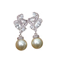 🌸 Boucles d'oreilles élégantes en forme de fleur – Modèle en perles artificielles et cristaux