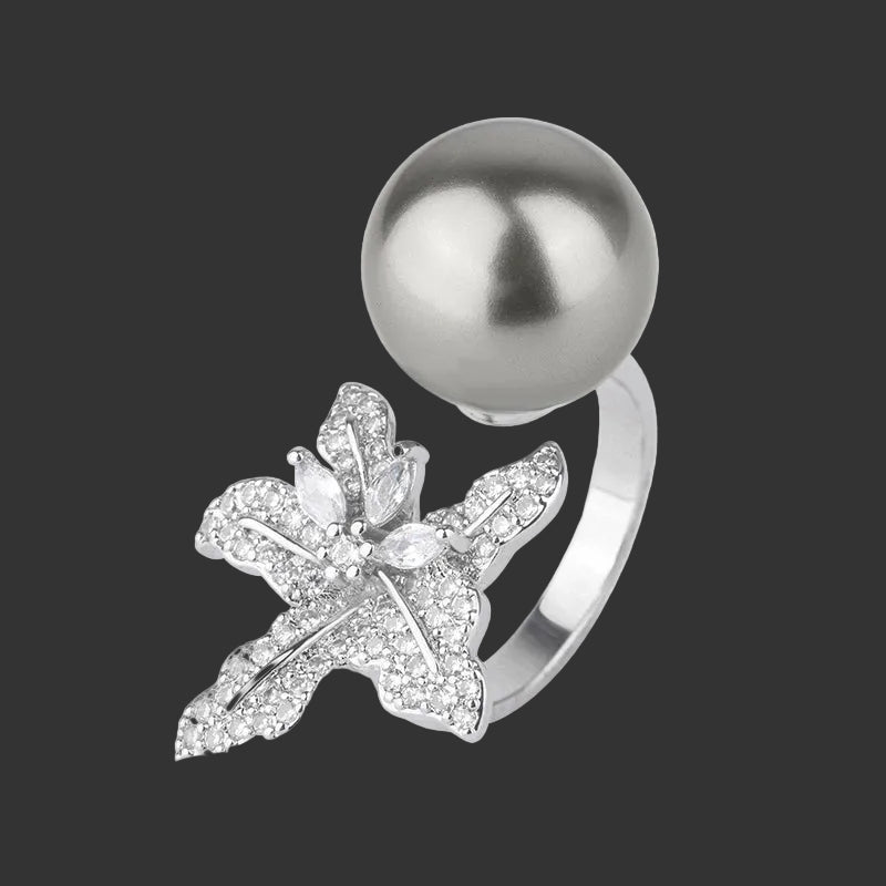 Anillo Huitan con flor de perla simulada: accesorio elegante y ajustable para mujer