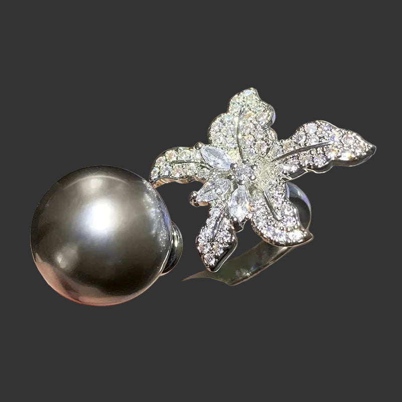 Anillo Huitan con flor de perla simulada: accesorio elegante y ajustable para mujer