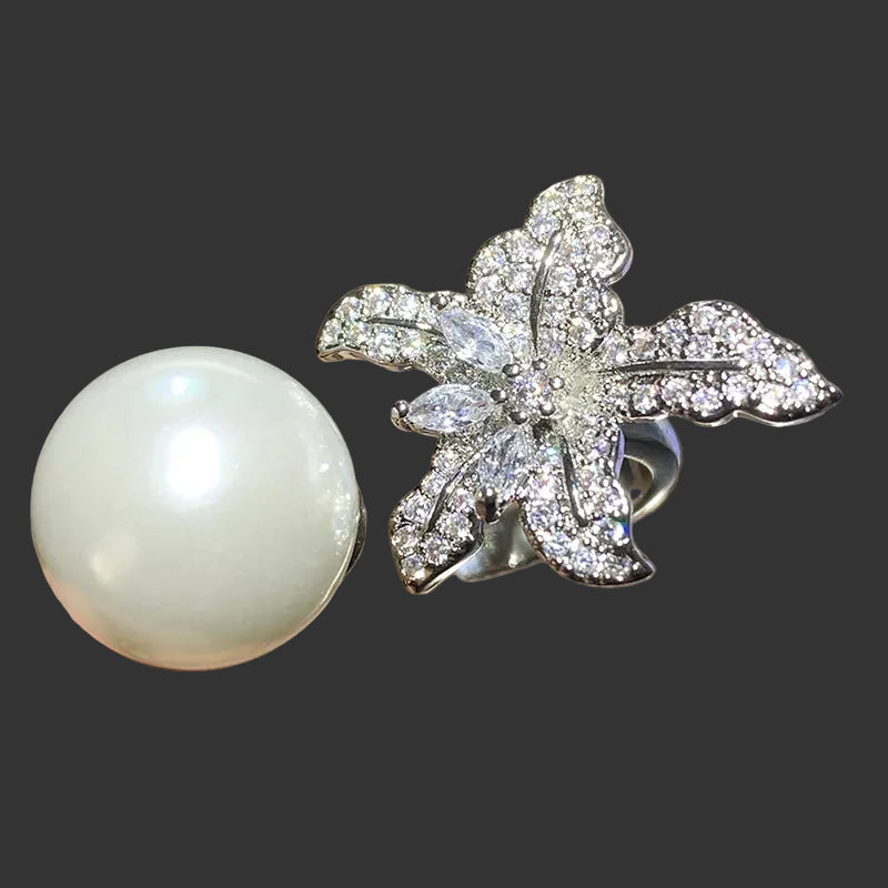 Anillo Huitan con flor de perla simulada: accesorio elegante y ajustable para mujer