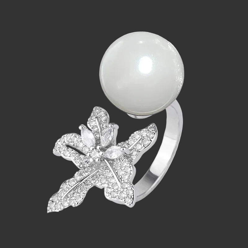 Anillo Huitan con flor de perla simulada: accesorio elegante y ajustable para mujer